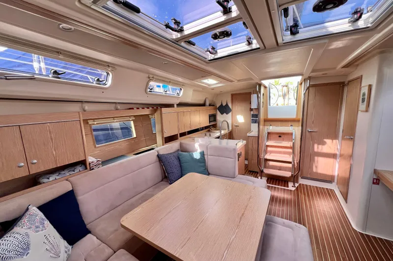 Slide: The Image of Luxurious interior of 2016 Hanse 455 yacht with modern furnishings and ample natural light. - 130