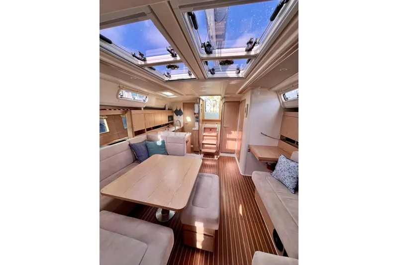 Slide: The Image of Luxurious interior of 2016 Hanse 455 yacht with skylights and elegant wood finishes. - 131