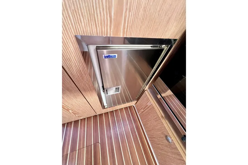 Slide: The Image of Stainless steel fridge on 2016 Hanse 455 yacht with wood paneling. - 138