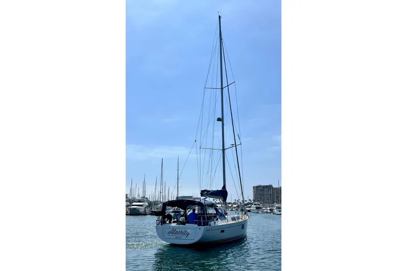 Slide: The Image of Sailing yacht Hanse 455, 2016 model, docked in a marina under a clear blue sky. - 14