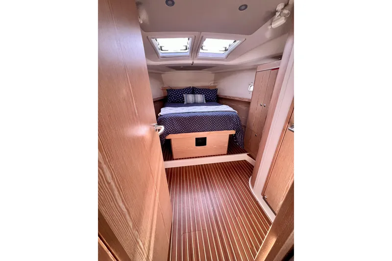Slide: The Image of Cozy cabin interior of 2016 Hanse 455 yacht with skylights and wooden flooring. - 153
