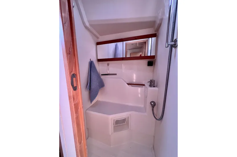 Slide: The Image of Compact bathroom in a 2016 Hanse 455 yacht, featuring a shower and mirror. - 166