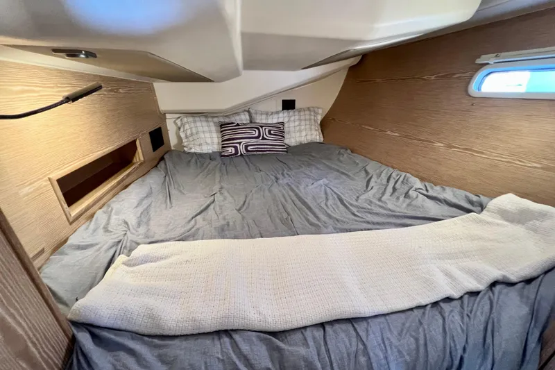 Slide: The Image of Cozy cabin interior of 2016 Hanse 455 yacht with comfortable bedding. - 171