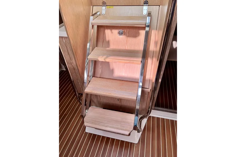 Slide: The Image of Wooden steps with metal rails inside a 2016 Hanse 455 yacht. - 183
