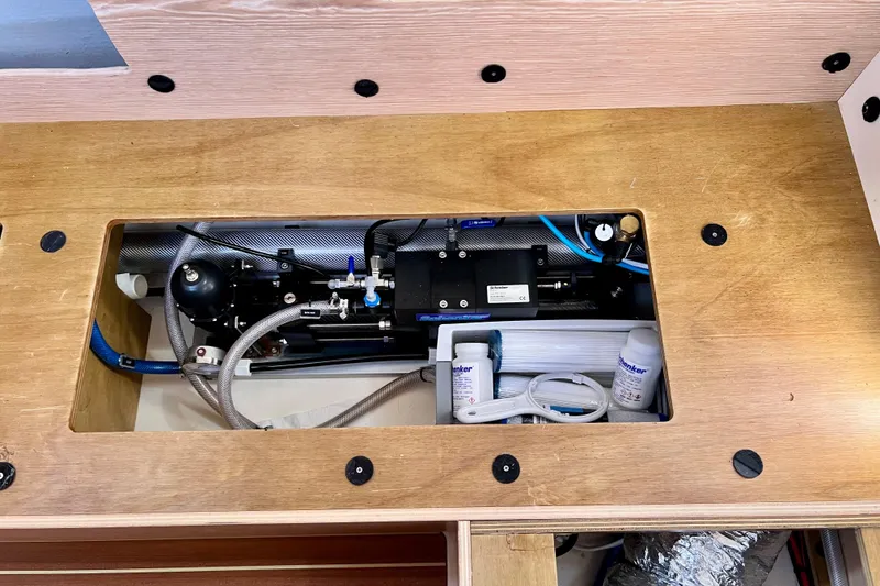 Slide: The Image of Interior view of a 2016 Hanse 455 yacht's technical compartment with equipment and wiring. - 189