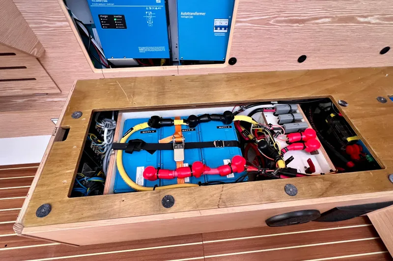Slide: The Image of Electrical system of a 2016 Hanse 455 yacht, featuring batteries and wiring. - 194