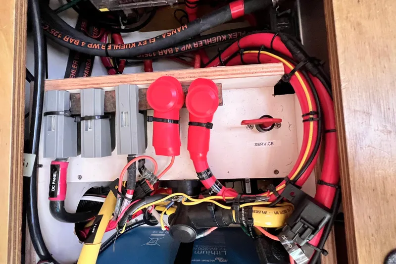 Slide: The Image of Electrical panel of a 2016 Hanse 455 yacht with cables and switches. - 197