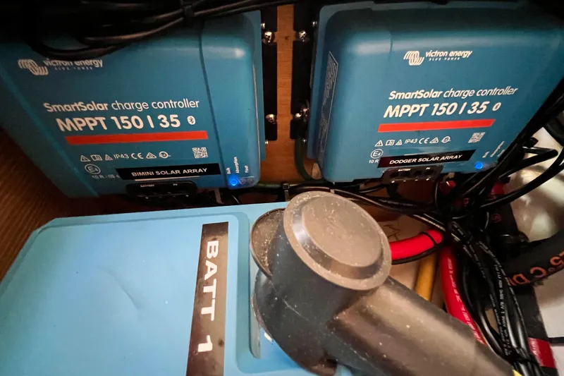 Slide: The Image of Victron Energy SmartSolar charge controllers in a 2016 Hanse 455 yacht's electrical setup. - 199