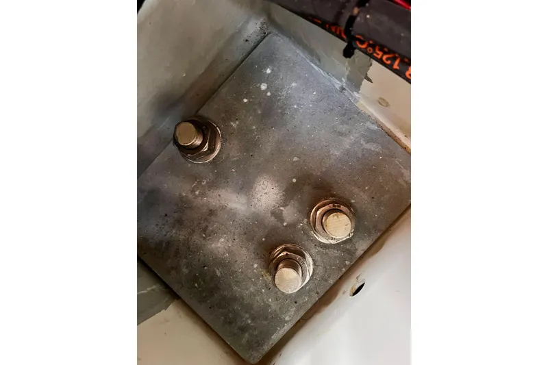 Slide: The Image of Close-up of a metal plate with bolts on a 2016 Hanse 455 yacht. - 201