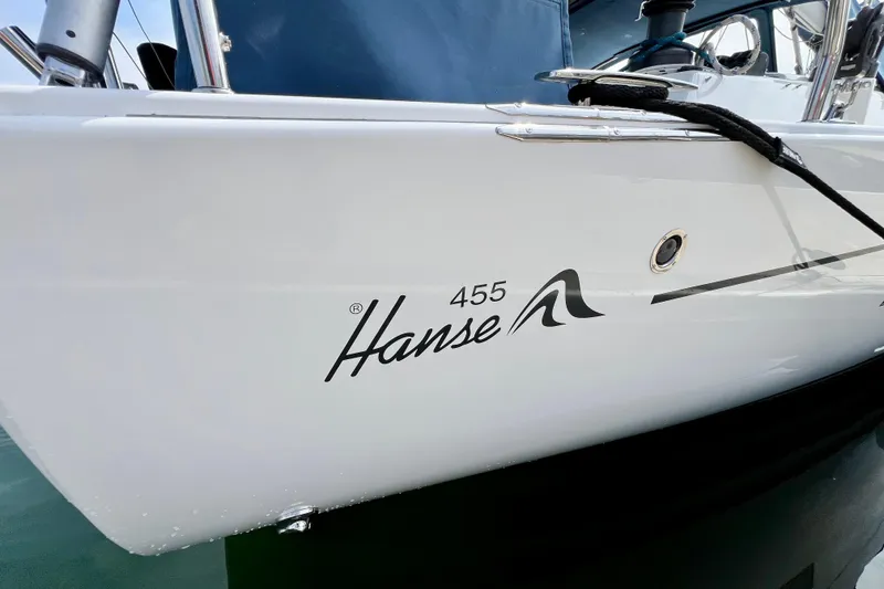 Slide: The Image of 2016 Hanse 455 sailboat side view with logo and mooring line. - 27