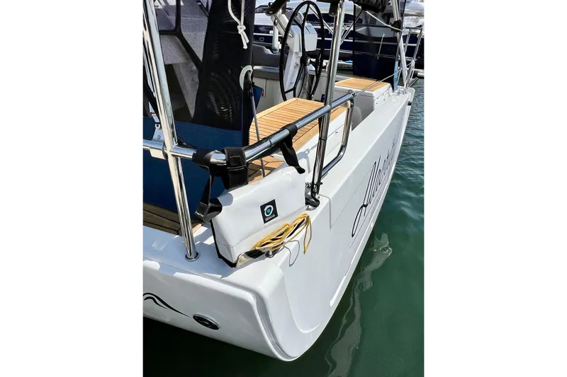 Slide: The Image of 2016 Hanse 455 yacht stern with teak decking and stainless steel railings. - 28