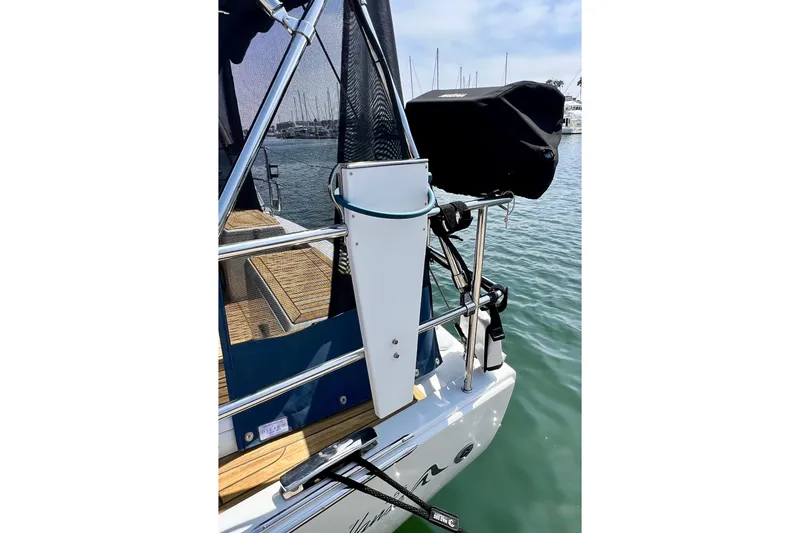 Slide: The Image of Sailboat Hanse 455 (2016) stern view with equipment and marina background. - 29