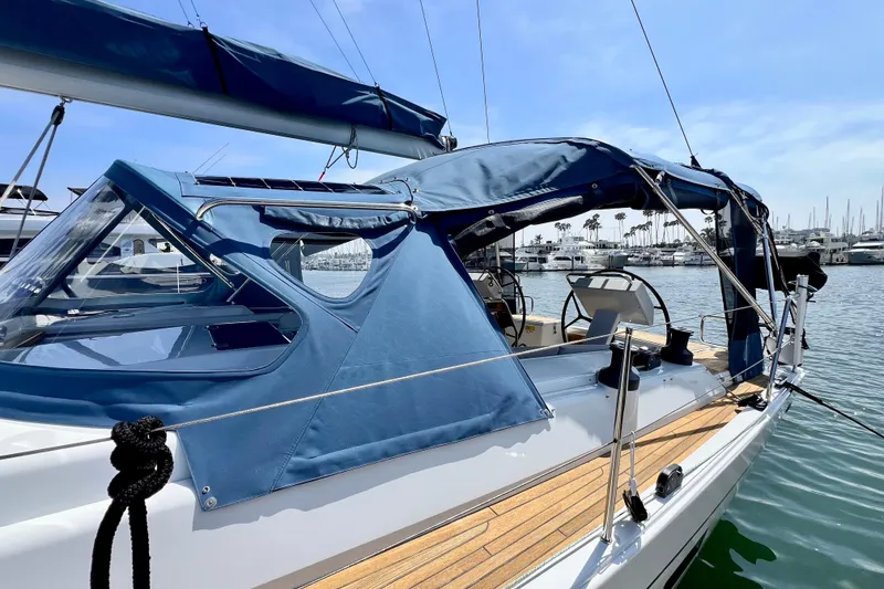 Slide: The Image of Sailboat Hanse 455 (2016) docked, featuring blue canopy and sleek design. - 30
