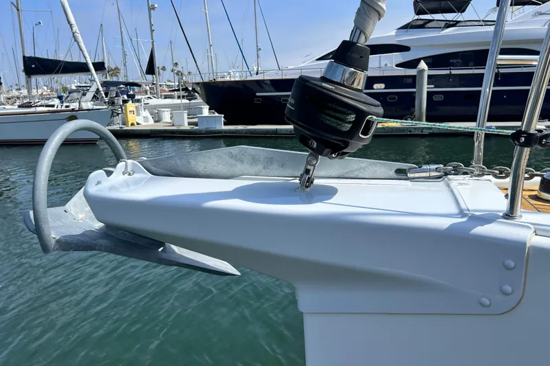 Slide: The Image of Bow of a 2016 Hanse 455 yacht with anchor and marina background. - 34