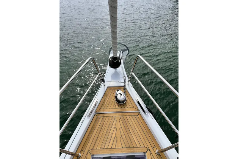 Slide: The Image of Bow of 2016 Hanse 455 yacht with teak deck and stainless steel railings. - 35