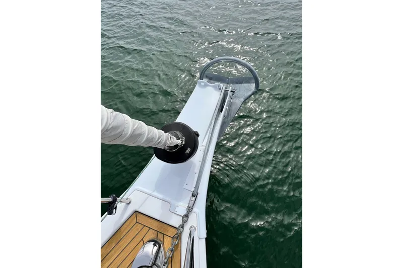 Slide: The Image of Bow of 2016 Hanse 455 yacht with anchor over calm water. - 36