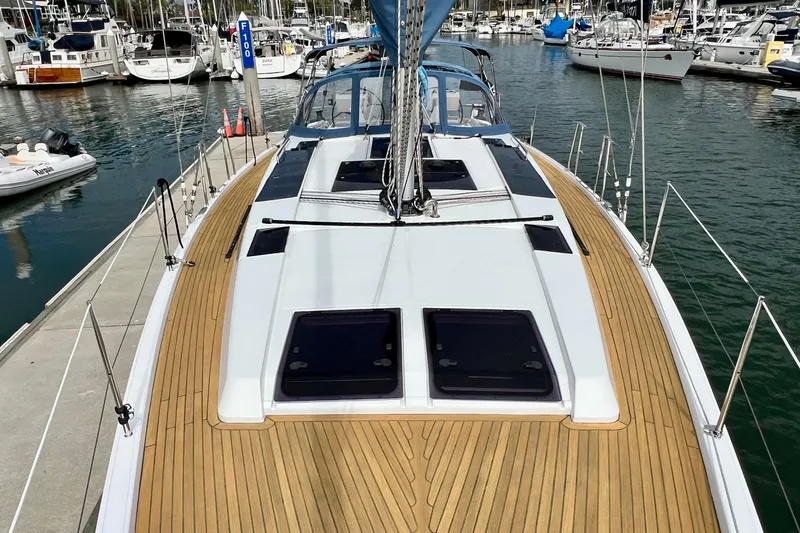 Slide: The Image of 2016 Hanse 455 sailboat docked in marina, featuring sleek deck design and modern fittings. - 39