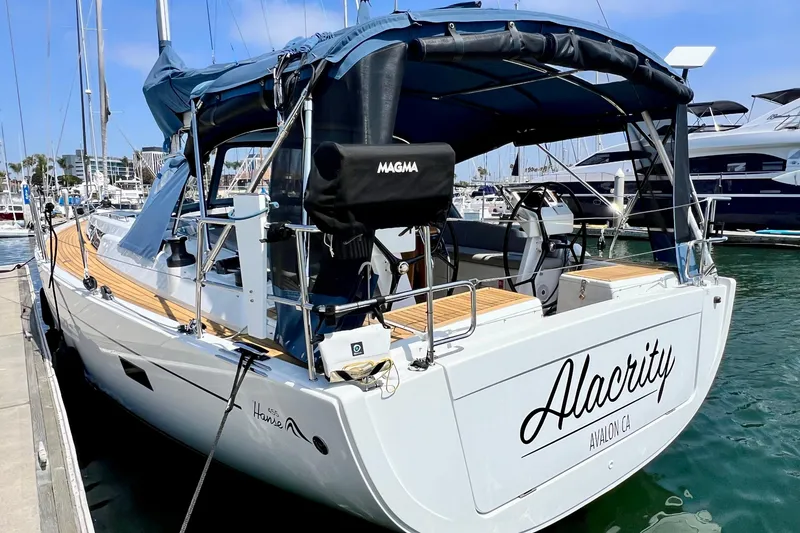 Slide: The Image of 2016 Hanse 455 sailboat named "Alacrity" docked at a marina. - 4