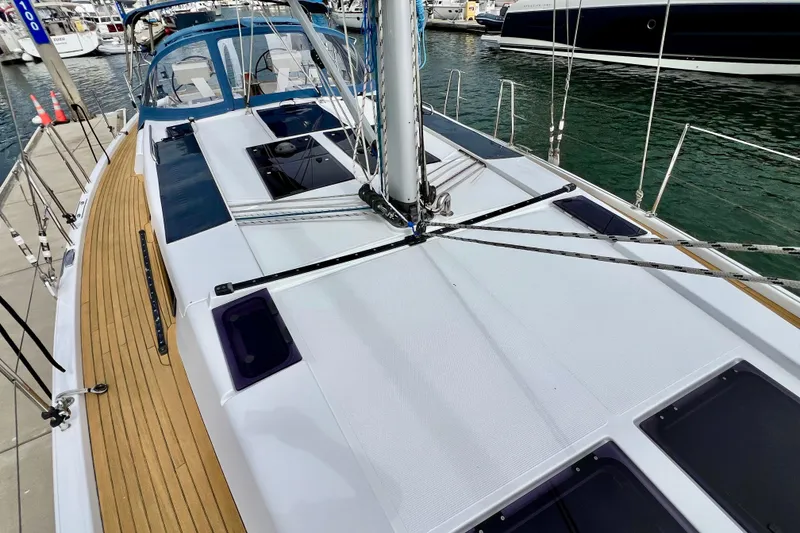 Slide: The Image of 2016 Hanse 455 sailboat docked, showcasing sleek deck design and modern features. - 40