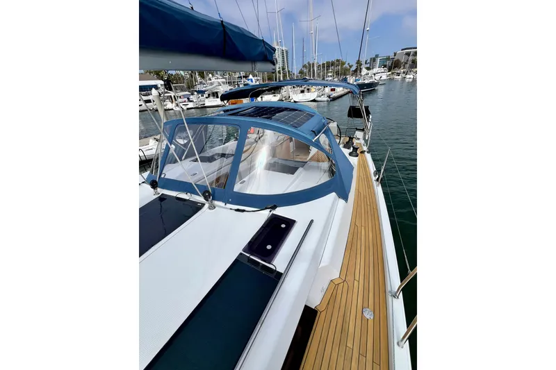 Slide: The Image of 2016 Hanse 455 sailboat docked in marina, featuring sleek design and spacious deck. - 43