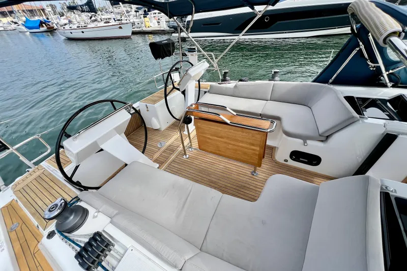 Slide: The Image of Spacious cockpit of 2016 Hanse 455 yacht with dual steering wheels and comfortable seating. - 47