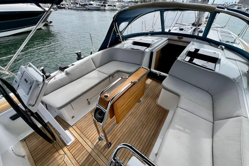 Slide: The Image of Interior view of a 2016 Hanse 455 yacht with elegant seating and wooden flooring. - 48