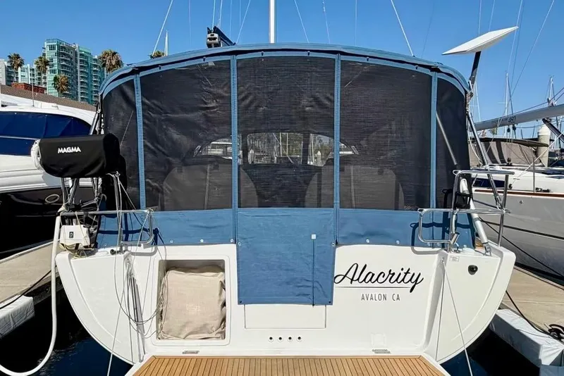 Slide: The Image of Hanse 455 sailboat, 2016 model, docked with blue canvas cover, named "Alacrity" in Avalon, CA. - 5