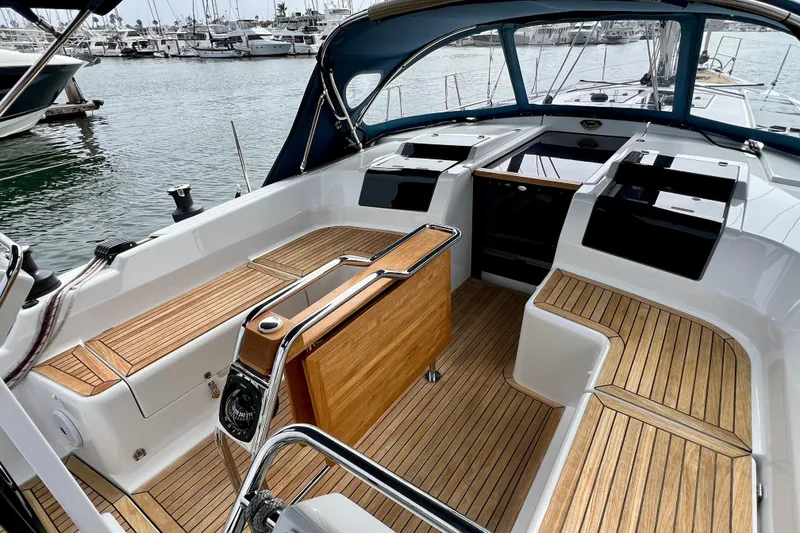 Slide: The Image of 2016 Hanse 455 yacht cockpit with teak flooring, docked at marina. - 53