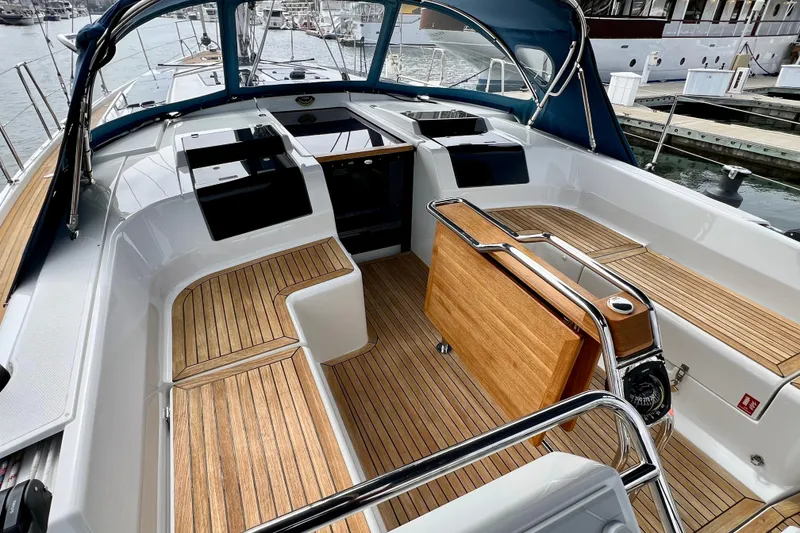 Slide: The Image of 2016 Hanse 455 yacht cockpit with teak flooring and sleek design at marina. - 55