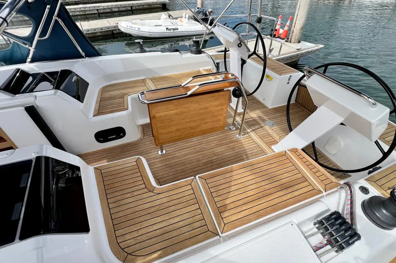 Slide: The Image of Cockpit of 2016 Hanse 455 yacht with dual steering wheels and teak flooring. - 59