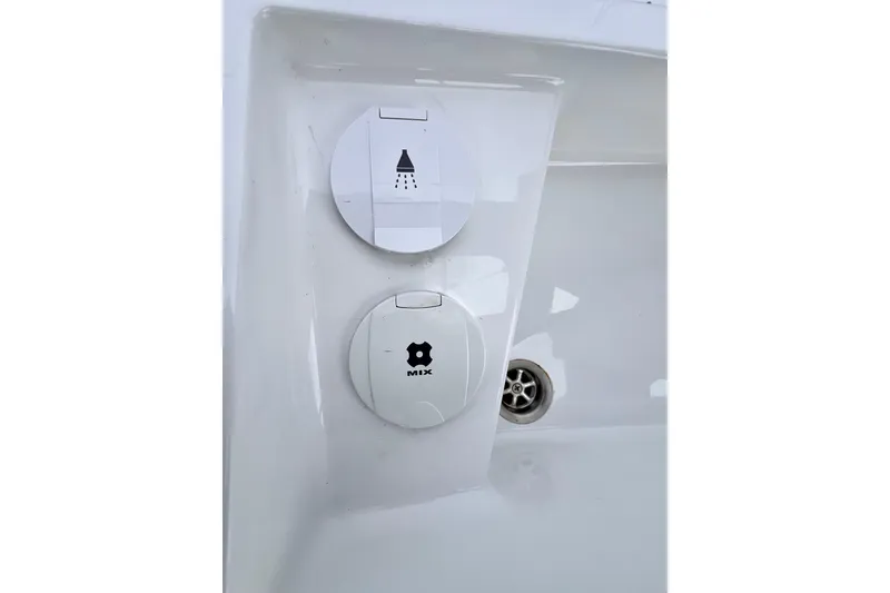 Slide: The Image of Hanse 455 2016 yacht shower and mixer controls on white panel. - 69