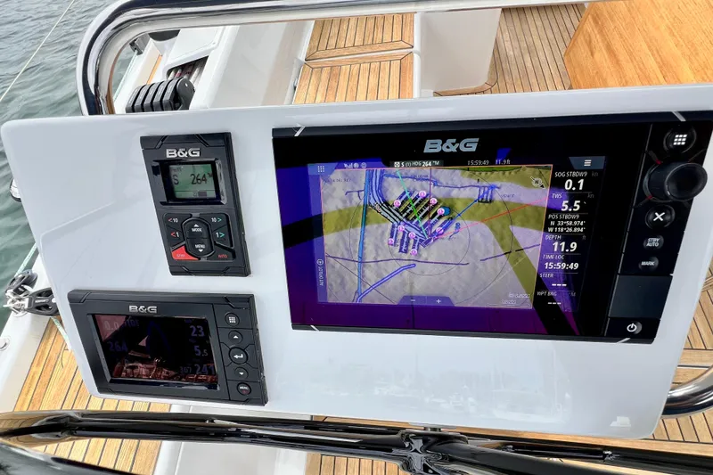 Slide: The Image of Navigation system on a 2016 Hanse 455 yacht, featuring B&G displays and controls. - 79