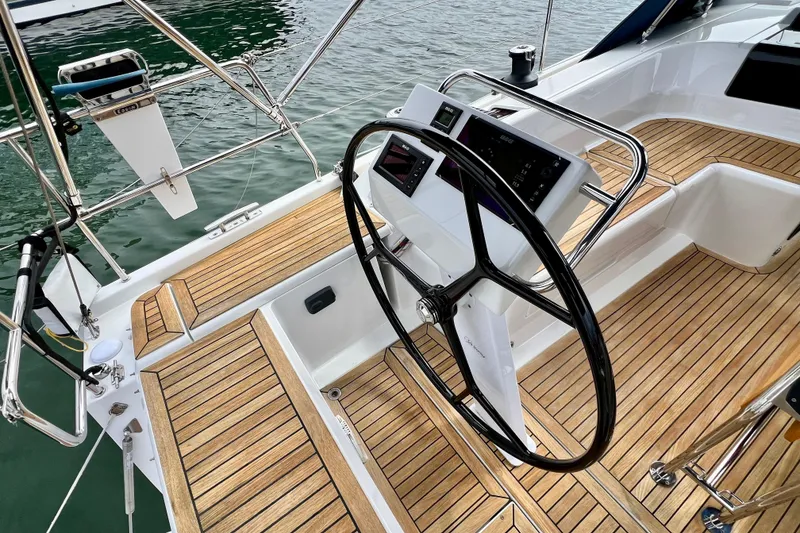 Slide: The Image of Steering wheel and cockpit of 2016 Hanse 455 yacht with teak flooring. - 85