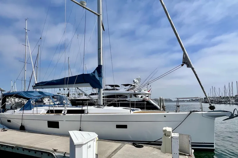 Slide: The Image of 2016 Hanse 455 sailboat docked at marina under clear blue sky. - 9