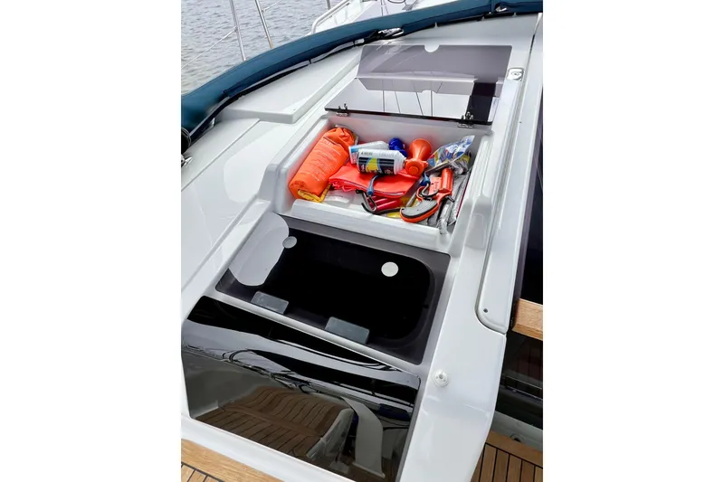 Slide: The Image of Storage compartment on 2016 Hanse 455 yacht, containing safety and maintenance equipment. - 92