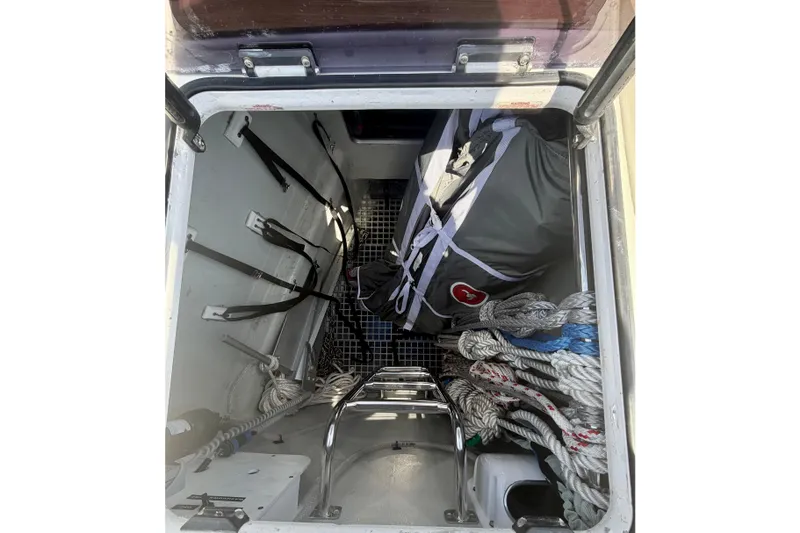 Slide: The Image of Storage compartment of a 2016 Hanse 455 yacht with ropes and equipment. - 95