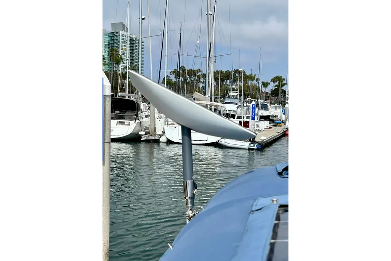 Slide: The Image of Sailboat Hanse 455 (2016) with satellite dish in marina, surrounded by other boats. - 96