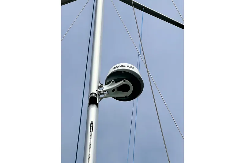 Slide: The Image of Radar equipment on a 2016 Hanse 455 sailboat mast against a clear sky. - 97