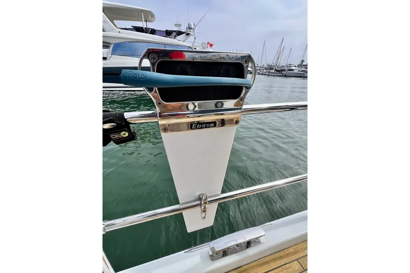 Slide: The Image of Sailboat steering pedestal on a 2016 Hanse 455, docked in a marina. - 99