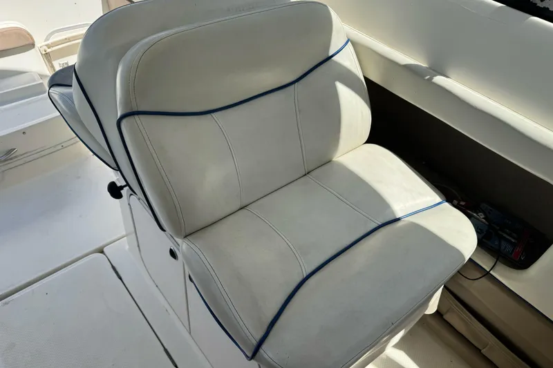 Slide: The Image of White leather seat on a 2005 Bayliner 222 Classic boat. - 17
