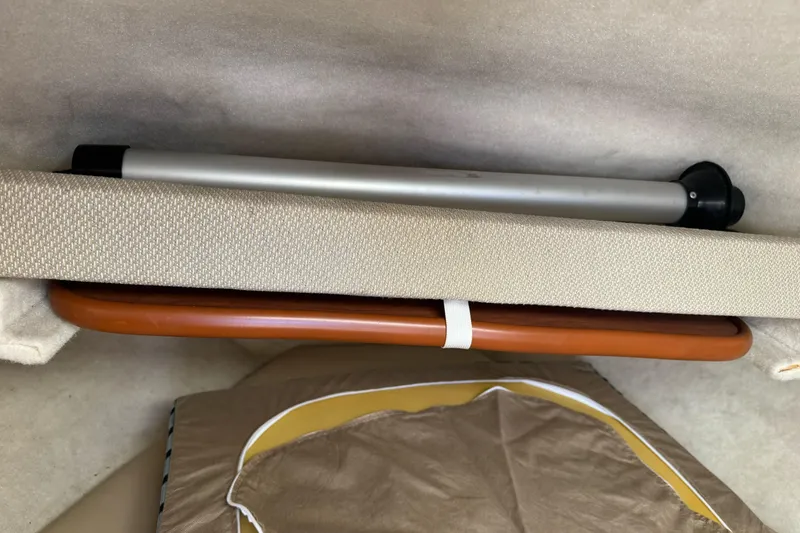 Slide: The Image of Interior storage compartment of a 2005 Bayliner 222 Classic boat. - 28