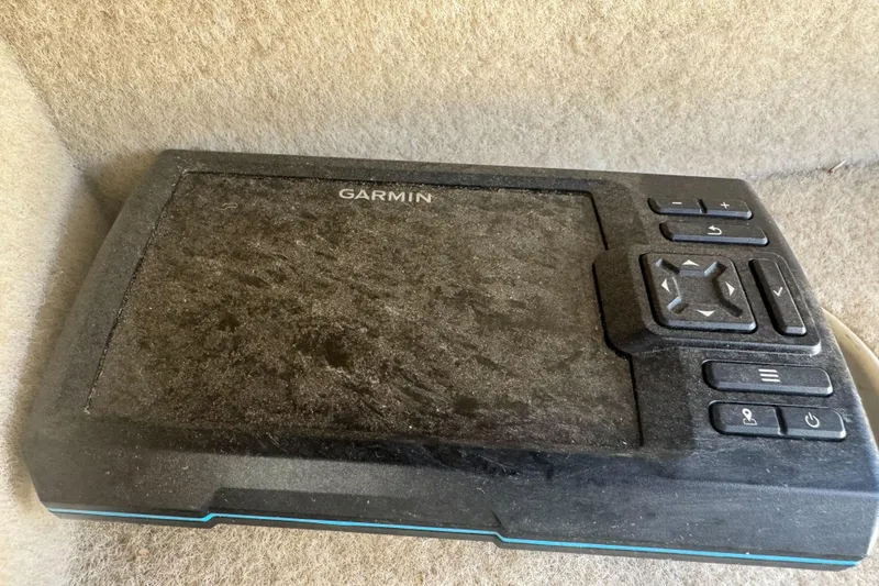Slide: The Image of Garmin navigation device on 2005 Bayliner 222 Classic boat, featuring control buttons and display. - 34