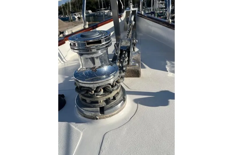 Slide: The Image of Chrome winch and chain on 1994 Hutting 40' sailboat deck. - 14