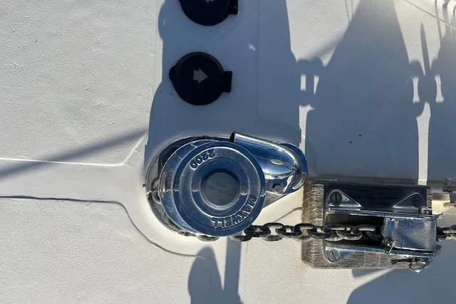 Slide: The Image of Chrome winch on 1994 Hutting 40' yacht deck with chain mechanism. - 15