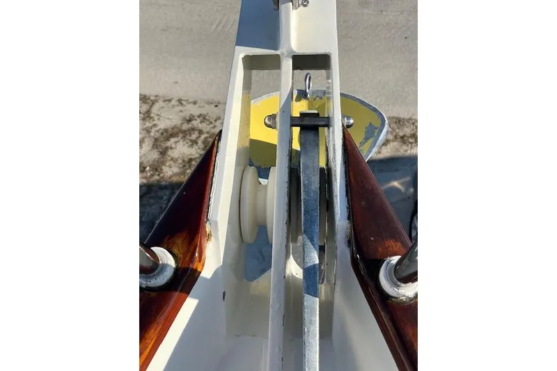 Slide: The Image of Close-up of a 1994 Hutting 40' sailboat's anchor mechanism with wooden accents. - 17