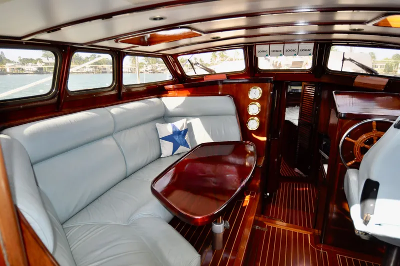 Slide: The Image of Luxurious 1994 Hutting 40' yacht interior with elegant wood finish and plush seating. - 20