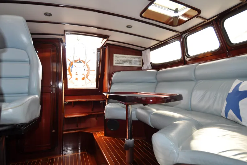 Slide: The Image of Interior of a 1994 Hutting 40' yacht with elegant wood and leather seating. - 24