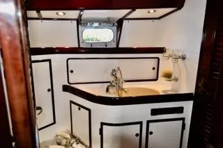 Slide: The Image of Luxurious bathroom interior of a 1994 Hutting 40' yacht with elegant fixtures. - 34