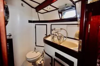 Slide: The Image of Luxurious bathroom in a 1994 Hutting 40' yacht with elegant wood accents. - 36
