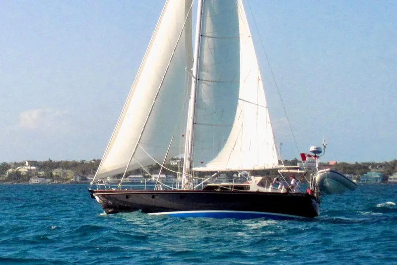 Slide: The Image of 1994 Hutting 40' sailboat on the water. - 4